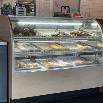 Luther Burger - Donut case; more donuts on the rack behind the vase as well - Burgers Near Me - Richmond, Virginia