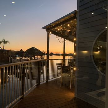 Riverfront Social - Sunset out the back window and outside seating. - American Near Me - Crystal River, Florida Riverfront Social - Sunset out the back window and outside seating. - American Near Me - Crystal River, Florida