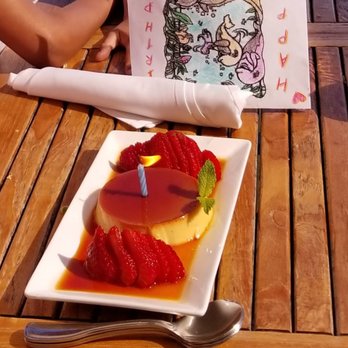Margaritaville - Flan doubles up as a birthday cake - Seafood Near Me - Capitola, California