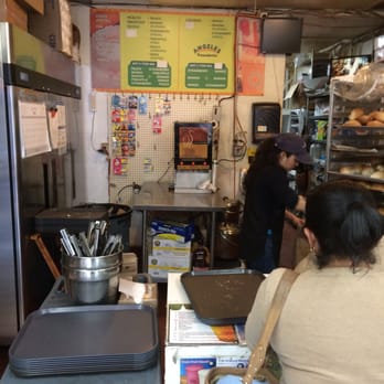 Angeles Bakery - Drink menu and racks of bolillo behind the counter - Bakeries Near Me - Los Angeles, California Angeles Bakery - Drink menu and racks of bolillo behind the counter - Bakeries Near Me - Los Angeles, California