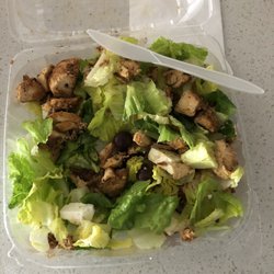 Half eaten Mediterranean salad. 2 Kenn's dressings on the side.