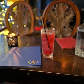 The Red Accordion - a glass of drink on a table - Cocktail Bars Near Me - Vancouver, British Columbia The Red Accordion - a glass of drink on a table - Cocktail Bars Near Me - Vancouver, British Columbia