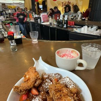 Ruby Slipper Central Business District - SWEET HEAT CHICKEN & FRENCH TOAST BITES Fried chicken and fresh strawberries tossed in Mike's Hot Honey glaze over French toast bites - Breakfast & Brunch Near Me - New Orleans, Louisiana