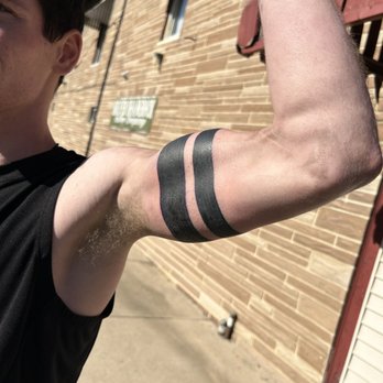 Shamrock - a man flexing his arm in front of a brick building - Bars Near Me - Lock Haven, Pennsylvania Shamrock - a man flexing his arm in front of a brick building - Bars Near Me - Lock Haven, Pennsylvania