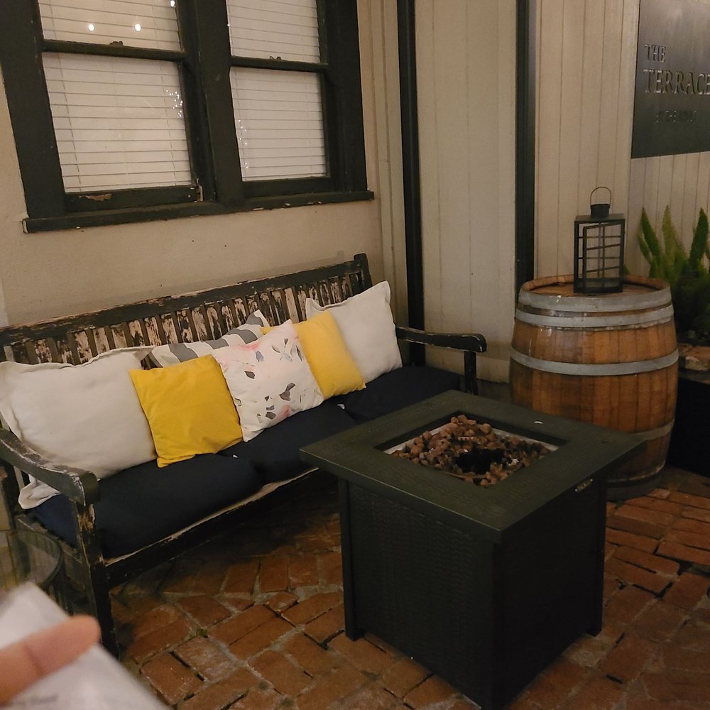Pourr Decisions wine lounge - patio with a fire pit - Wine Bars Near Me - Modesto, California Pourr Decisions wine lounge - patio with a fire pit - Wine Bars Near Me - Modesto, California