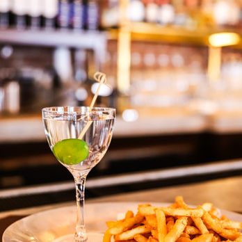Felice Brickell - A crisp gin or vodka martini garnished with a single olive, served on a silver platter alongside a heap of seasoned fries at ... - Italian Near Me - Miami, Florida Felice Brickell - A crisp gin or vodka martini garnished with a single olive, served on a silver platter alongside a heap of seasoned fries at ... - Italian Near Me - Miami, Florida