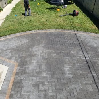 Danny and Sons Irrigation and Landscaping - two men working on a patio - Landscaping Near Me - Chicago, Illinois Danny and Sons Irrigation and Landscaping - two men working on a patio - Landscaping Near Me - Chicago, Illinois