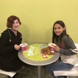 two people sitting at a table two people sitting at a table
