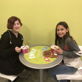Menchies Frozen yogurt - two people sitting at a table - Ice Cream & Frozen Yogurt Near Me - Longview, Texas Menchies Frozen yogurt - two people sitting at a table - Ice Cream & Frozen Yogurt Near Me - Longview, Texas