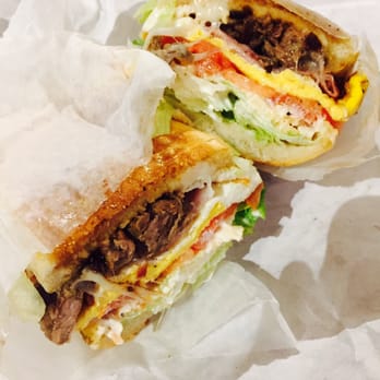 Cafecito - A Chivito Sandwich w/out Onions: containing steak, egg, lettuce, tomato, flavored mayo, cheese and all toasted on flatbread! - Coffee & Tea Near Me - Chicago, Illinois Cafecito - A Chivito Sandwich w/out Onions: containing steak, egg, lettuce, tomato, flavored mayo, cheese and all toasted on flatbread! - Coffee & Tea Near Me - Chicago, Illinois