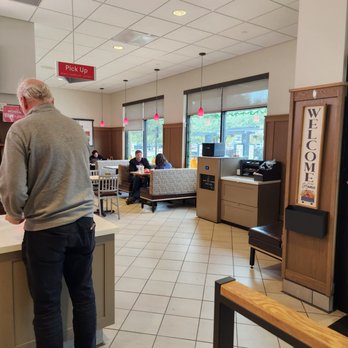 Chick-fil-A - ows a man standing at a counter in a restaurant - Fast Food Near Me - Austin, Texas