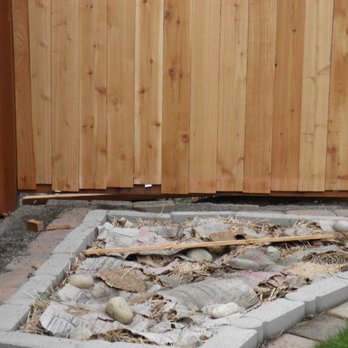Cedar River Construction - Gap at bottom of fence and top of rockery. - Fences & Gates Near Me - Maple Valley, Washington Cedar River Construction - Gap at bottom of fence and top of rockery. - Fences & Gates Near Me - Maple Valley, Washington