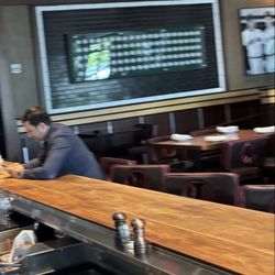 Tony C's Sports Bar & Grill - General manager sitting at the bar doom scrolling, not helping staff or guests??