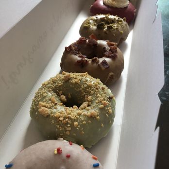 Petit Three Doughnuts - Celebration cake, jalapeño cornbread, maple bacon, olive pistachio, strawberry hibiscus cheesecake, vegan coconut chocolate - Donuts Near Me - Aurora, Illinois