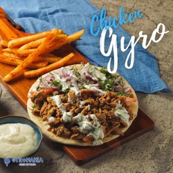 Gyromania - - Marinated Chicken gyro wrap with a side of fries.
- Tomatoes, Onions, Parsley toppings
- Tzatziki Sauce