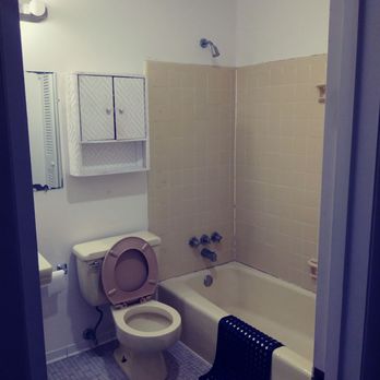 Property Doctor - a bathroom with a toilet and bathtub - General Contractors Near Me Property Doctor - a bathroom with a toilet and bathtub - General Contractors Near Me