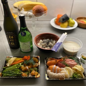 Kiraku - Salmon Poke, Sashimi platter, Tofu, and Sake bottles (take out) - Tapas/Small Plates Near Me - Berkeley, California
