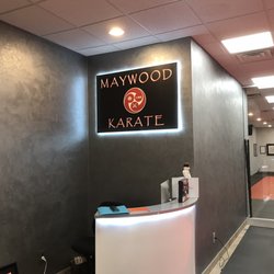 Maywood Karate - Front desk area and back-lit Maywood karate sign.
