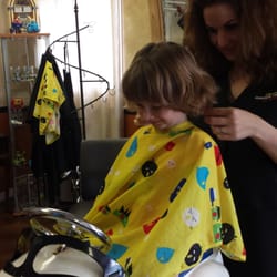 Classics Haircuts for Kids and Adults - My little girl loving the car seat!