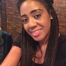 a smiling woman with braids a smiling woman with braids