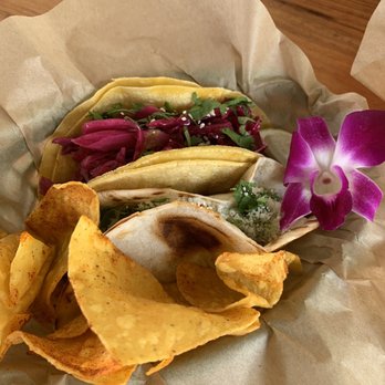 Messy's Tacos - Decadent Korean beef taco on corn Tortilla and carne asada taco on flour. They garnish them with orchids!!!! - Tacos Near Me Messy's Tacos - Decadent Korean beef taco on corn Tortilla and carne asada taco on flour. They garnish them with orchids!!!! - Tacos Near Me