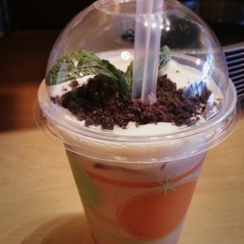 Sushi Secrets - Cow milk tea?  I forget what it's called lol.  Mint leaf on oreo crumble "dirt" with crema and milk tea below. ($3.70) - Japanese Near Me - Berkeley, California