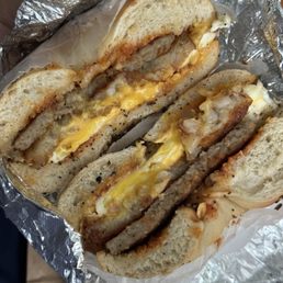 Sausage egg and cheese with a hashbrown on a toasted everything bagel Sausage egg and cheese with a hashbrown on a toasted everything bagel