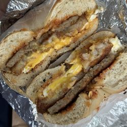 Schuyler Bagel Deli - Sausage egg and cheese with a hashbrown on a toasted everything bagel