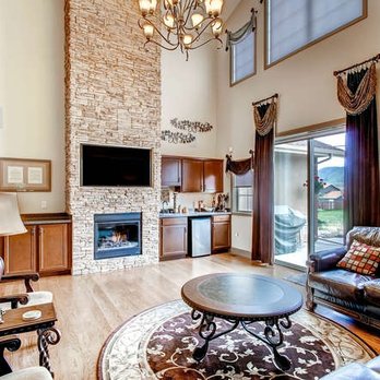 Pregio Homes - a living room with a stone fireplace - General Contractors Near Me - Colorado Springs, Colorado Pregio Homes - a living room with a stone fireplace - General Contractors Near Me - Colorado Springs, Colorado