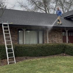 Precision Softwash and Pressure Washing - Flushing out gutters in Union, IL after cleaning them.
