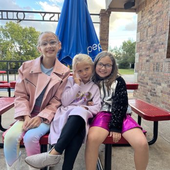 Daisy Queen - The girls enjoying eating on the patio - American Near Me - Marshall, Arkansas