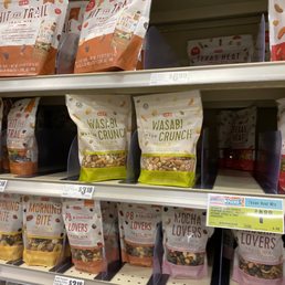 ows a variety of snacks on shelves
