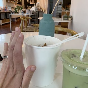 Raw Republic - a person's hand and a cup of green tea - Vegan Near Me - New Orleans, Louisiana Raw Republic - a person's hand and a cup of green tea - Vegan Near Me - New Orleans, Louisiana