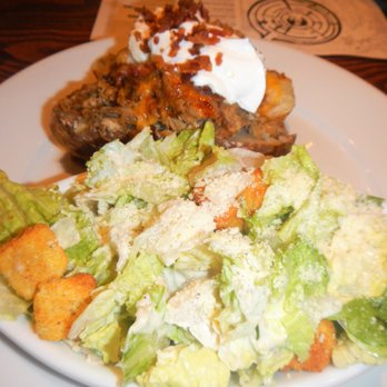 Smokey Bones - Loaded pulled pork baked potato and Caesar side salad. - Barbeque Near Me - Peachtree City, Georgia Smokey Bones - Loaded pulled pork baked potato and Caesar side salad. - Barbeque Near Me - Peachtree City, Georgia