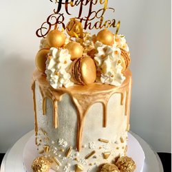 Sweet Indulgence Cakery - Coconut sponge cake with lemon curd filling and a coconut buttercream frosting.