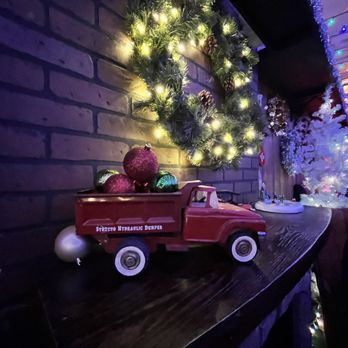 Happy's: A Holiday Bar - a red truck with a christmas tree in the back - Cocktail Bars Near Me - Chicago, Illinois Happy's: A Holiday Bar - a red truck with a christmas tree in the back - Cocktail Bars Near Me - Chicago, Illinois