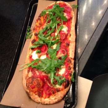 &pizza - Blend of traditional  and spicy sauce on regular dough with mozzarella and shredded cheese, pepperoni, cherry tomatoes, &arugula - Pizza Near Me - Washington, DC, District of Columbia