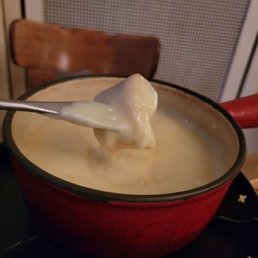 Dipping bread in the house fondue Dipping bread in the house fondue