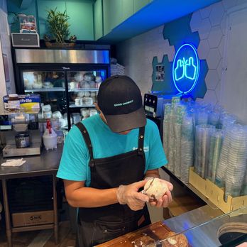 Good Coconut - Man carving a coconut for me - Bubble Tea Near Me - Flushing, New York