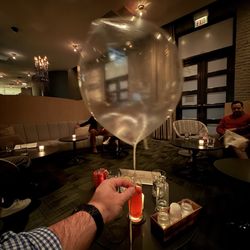 The Aviary - The iconic Green Apple Balloon dessert, created by chef Grant Achatz at Michelin-starred restaurant Alinea, is now available at The Aviary.