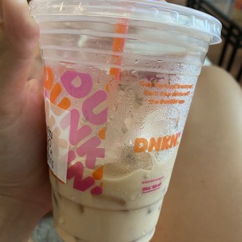 Dunkin' - a hand holding a cup of iced coffee - Donuts Near Me - Greenville, South Carolina Dunkin' - a hand holding a cup of iced coffee - Donuts Near Me - Greenville, South Carolina