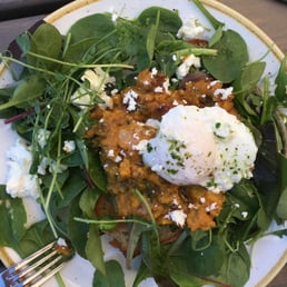 Pumpkin bruschetta with a poached egg on greens Pumpkin bruschetta with a poached egg on greens