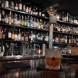The In Between - VoldeMalort and the liquor wall. They've got some amazing stuff up on those shelves..
