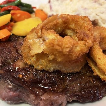 Georgie's Diner - Rib eye steak topped with onion rings. Served with mashed potatoes and fresh cut steamed veggies. - Diners Near Me - Saint Augustine, Florida