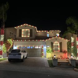 Stars Holiday Lighting - Red and white roofline, garage, window, ground, & tree lighting installed by Stars Holiday Lighting in Chatsworth, CA