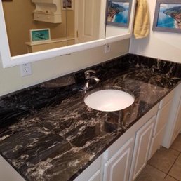 We were able to use a remnant from one of the slabs in our guest bath - HUGE improvement! (countertop is Oscuro Mist) We were able to use a remnant from one of the slabs in our guest bath - HUGE improvement! (countertop is Oscuro Mist)