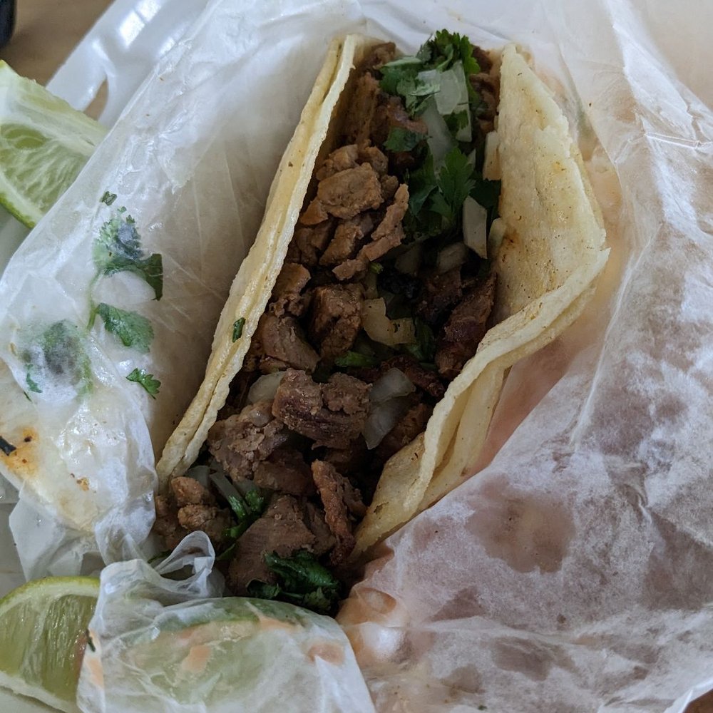 Toros Taqueria - Not the most flattering of photos, but that's one meaty taco. Two tacos + rice + beans + aguas as a meal is definitely filling. - Tacos Near Me - Norwalk, California