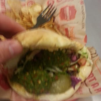 Naf Naf Grill - Filled to the MAX! Steak Shawarma, humus, green sauce, chopped salad, red cabbage, special onions, and even a few pickles. - Middle Eastern Near Me - Minneapolis, Minnesota Naf Naf Grill - Filled to the MAX! Steak Shawarma, humus, green sauce, chopped salad, red cabbage, special onions, and even a few pickles. - Middle Eastern Near Me - Minneapolis, Minnesota