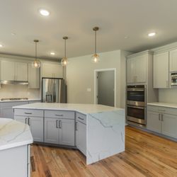 Solid Rock Company - Quartz counter top with a waterfall edge.