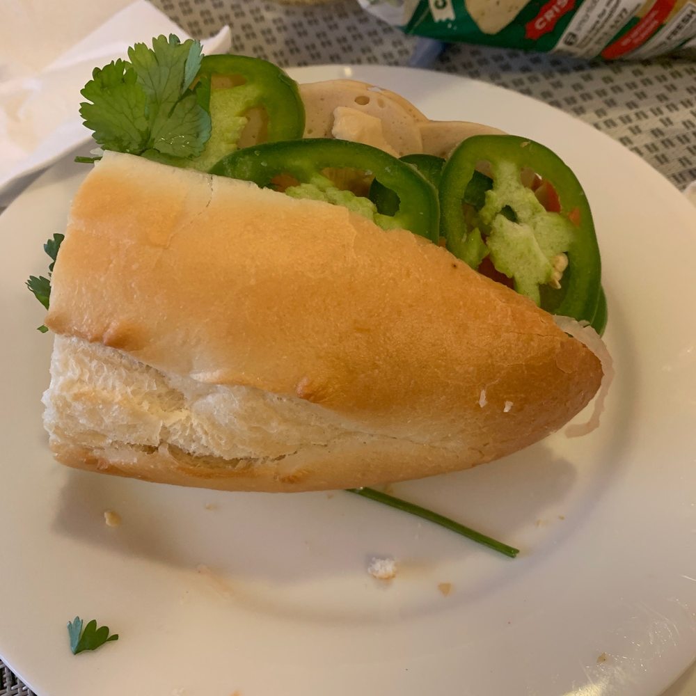 Steam pork sandwich and a bag of chips. Delicious